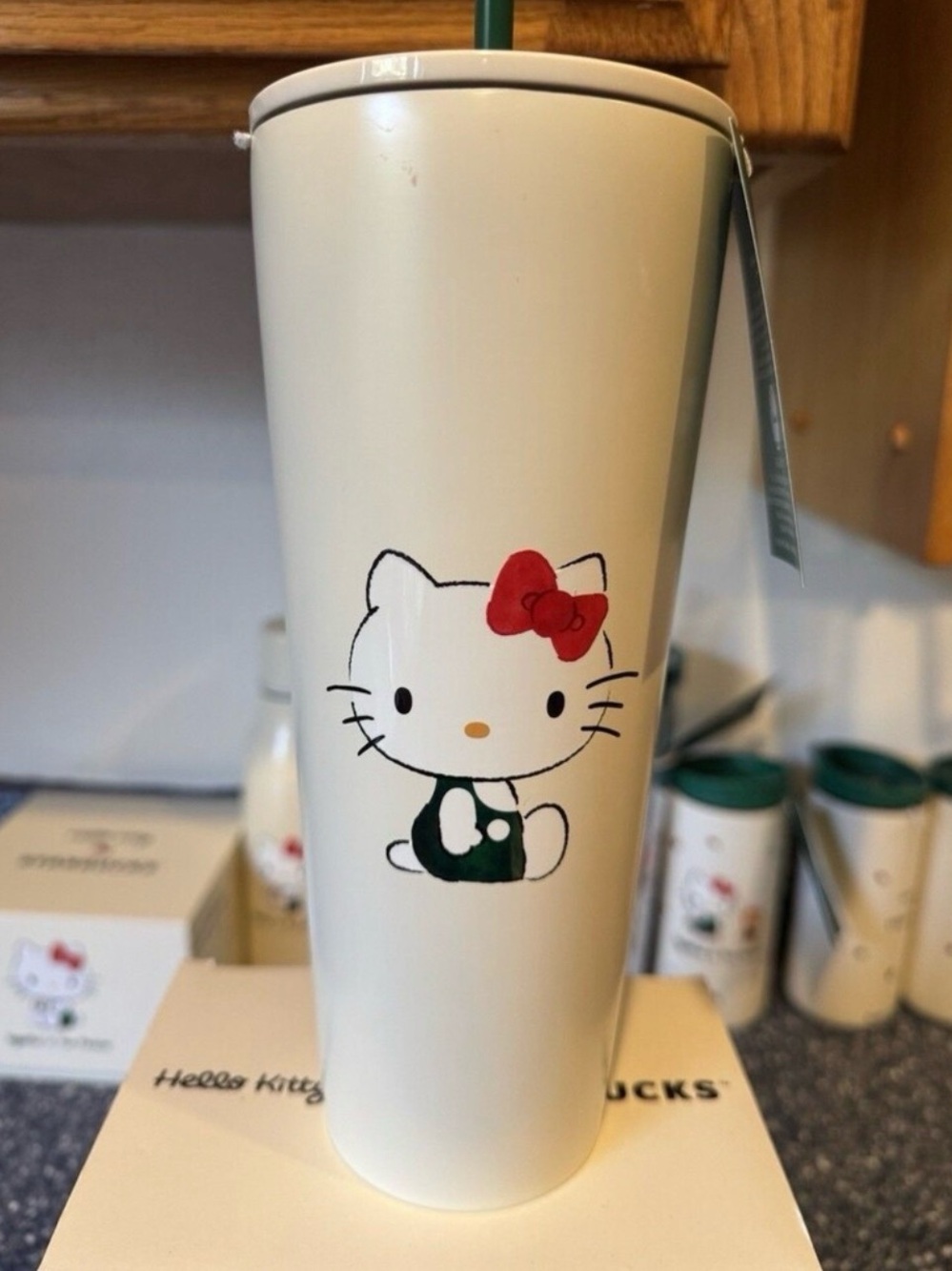 Starbucks Cream Tumbler with Green Tag and Red Bow Accent